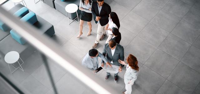 Corporate teamworking colleagues in modern office